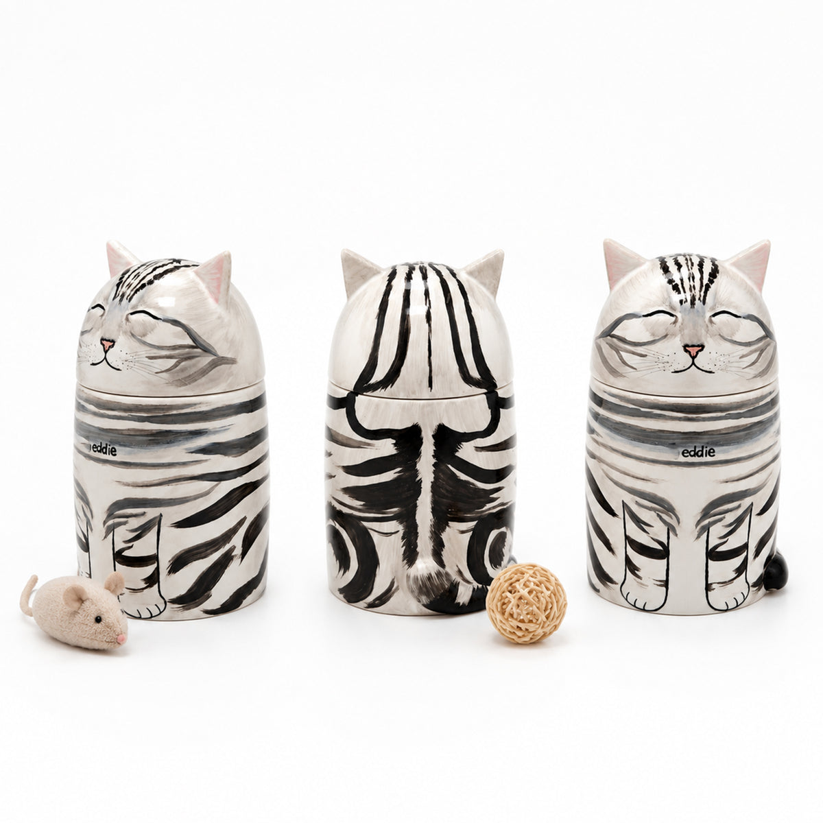 Three personalized cat memorial urns with matching ceramic keepsakes