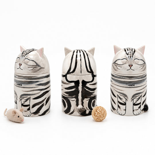 Three personalized cat memorial urns with matching ceramic keepsakes
